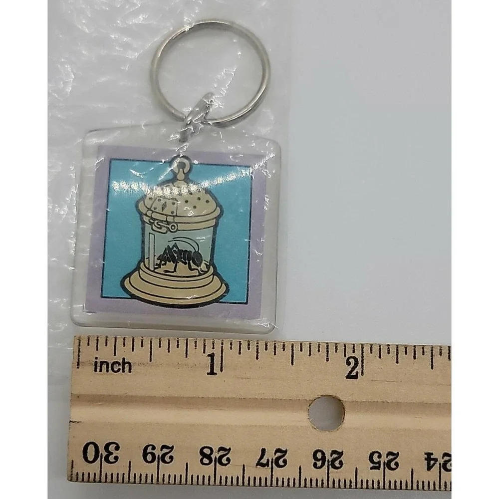 Best Wishes from Dorsey Laboratories ad advertising grasshopper in cage keychain